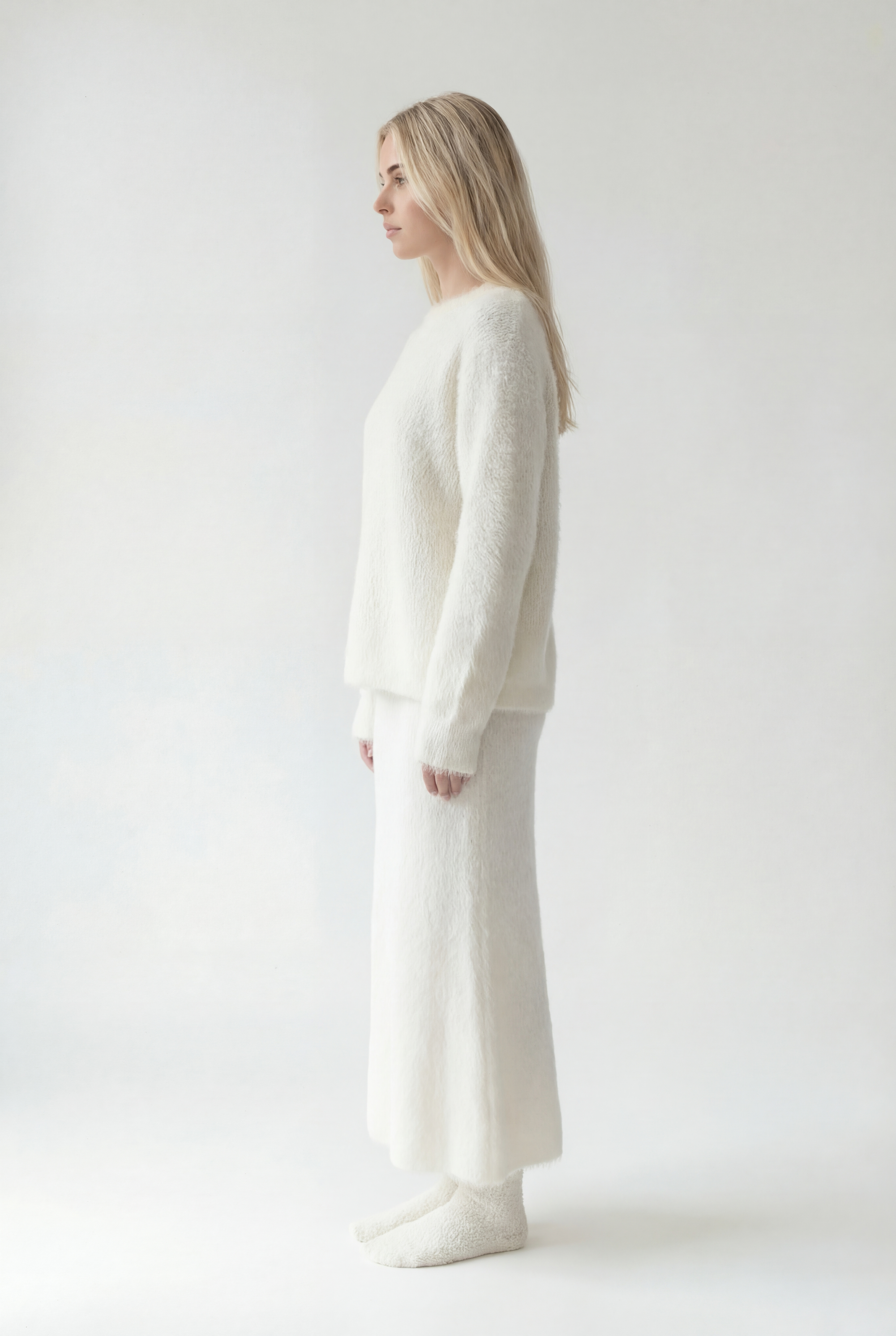 Ilgesnio silueto megztas komplektas